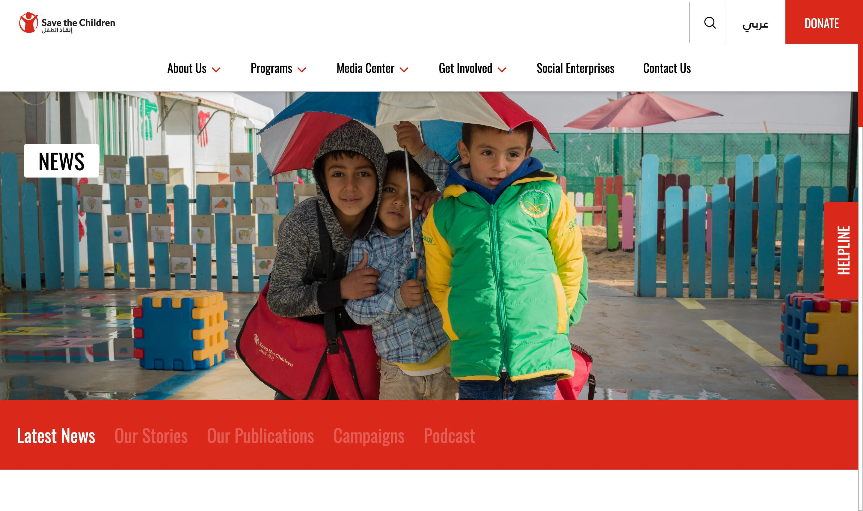 Save the Children Jordan Media Center page with a banner photo of children and a section tab bar for Latest News, Our Stories, Our Publications, Campaigns, and Podcast